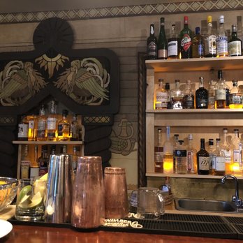 Cook Weaver - a bar filled with bottles of alcohol - Modern European Near Me - Seattle, Washington Cook Weaver - a bar filled with bottles of alcohol - Modern European Near Me - Seattle, Washington