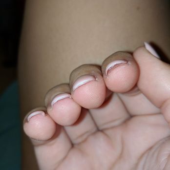 Smiley Nails - He fixed the pointer finger. It's so thick you can see the layer of acrylic perfectly under the layer of paint. Also super uneven. - Nail Salons Near Me - Honolulu, Hawaii