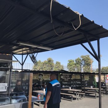 Jalisco's tacos - a man standing under a awning - Tacos Near Me - Tulare, California Jalisco's tacos - a man standing under a awning - Tacos Near Me - Tulare, California