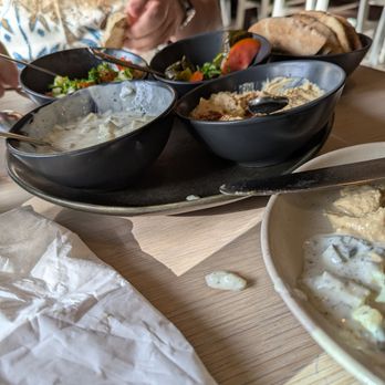 Maydoon - Humus, cucumber mint yogurt dip, olives and dolmeh. - Persian/Iranian Near Me - Sacramento, California Maydoon - Humus, cucumber mint yogurt dip, olives and dolmeh. - Persian/Iranian Near Me - Sacramento, California
