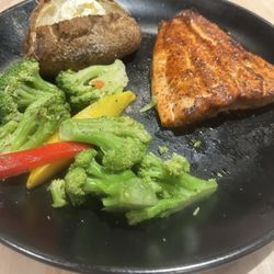 Cugino's Craft Kitchen - Salmon, baked potato, and mixed vegetables. .