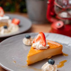 Patria Mia Puertorican Chinchorro - Cheese Flan - Traditional Puerto Rican flan made with cream cheese for a rich, smooth texture.