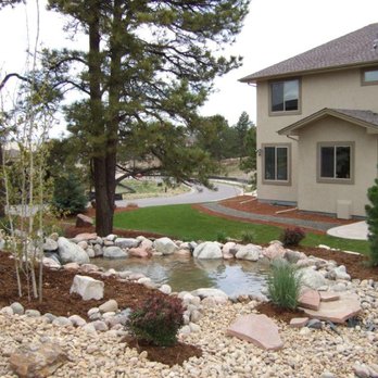 Outdoor Legacy - a front yard with a pond and landscaping - Landscaping Near Me Outdoor Legacy - a front yard with a pond and landscaping - Landscaping Near Me
