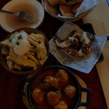 TAPS - Pan con tomate, Patatas Bravas, Queso a la plancha con miel y almendras, Albóndigas al estilo "TAPS" (top, left, right, bottom) - Tapas Bars Near Me - Barcelona, B TAPS - Pan con tomate, Patatas Bravas, Queso a la plancha con miel y almendras, Albóndigas al estilo "TAPS" (top, left, right, bottom) - Tapas Bars Near Me - Barcelona, B