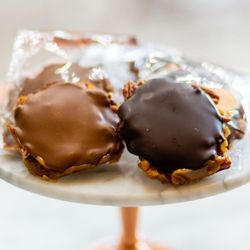 Lula's Chocolates - Caramel holds together pecans with milk or dark chocolate on top of these turtles. Also available with macadamia nuts.