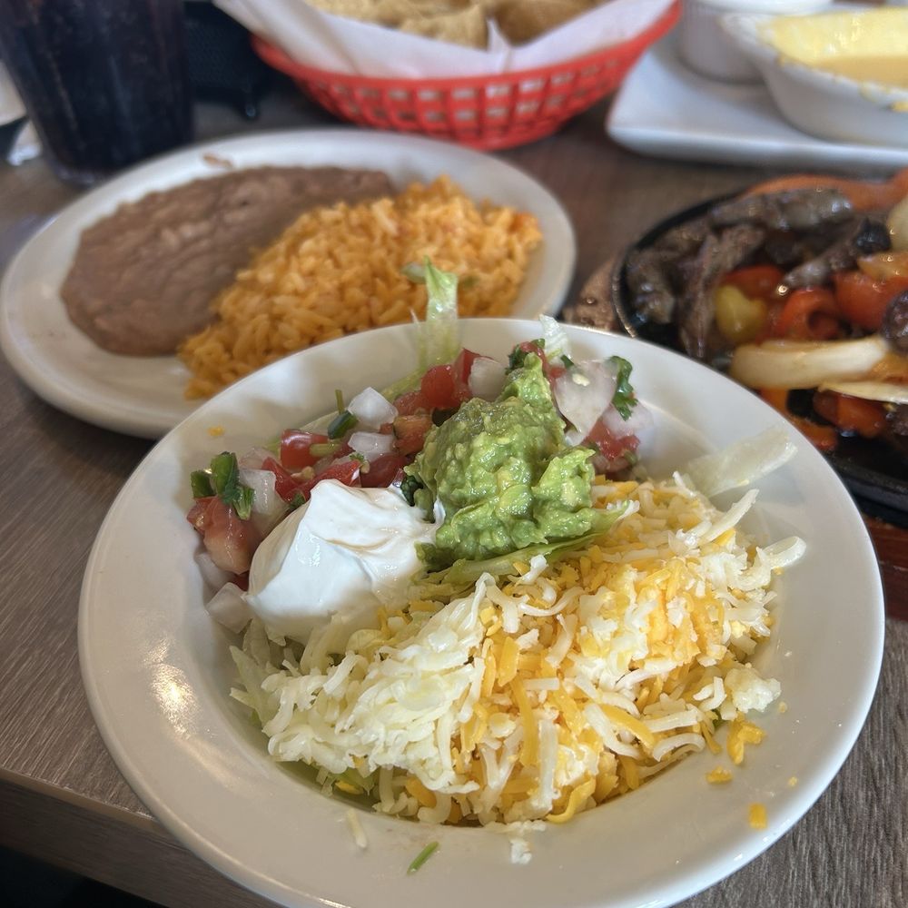 Dos Hermanos - Fajitas side toppings - Bars Near Me - Cedar Park, Texas