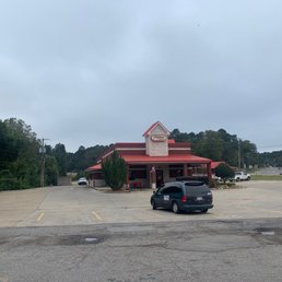 a parking lot with a car parked in front of it
