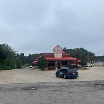Chicken Express - a parking lot with a car parked in front of it - Chicken Wings Near Me - Arkadelphia, Arkansas