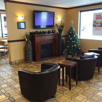 McDonald's - Super cute sitting area with flat screen TV, fireplace, & cozy chairs. - Fast Food Near Me - Sidney, Montana