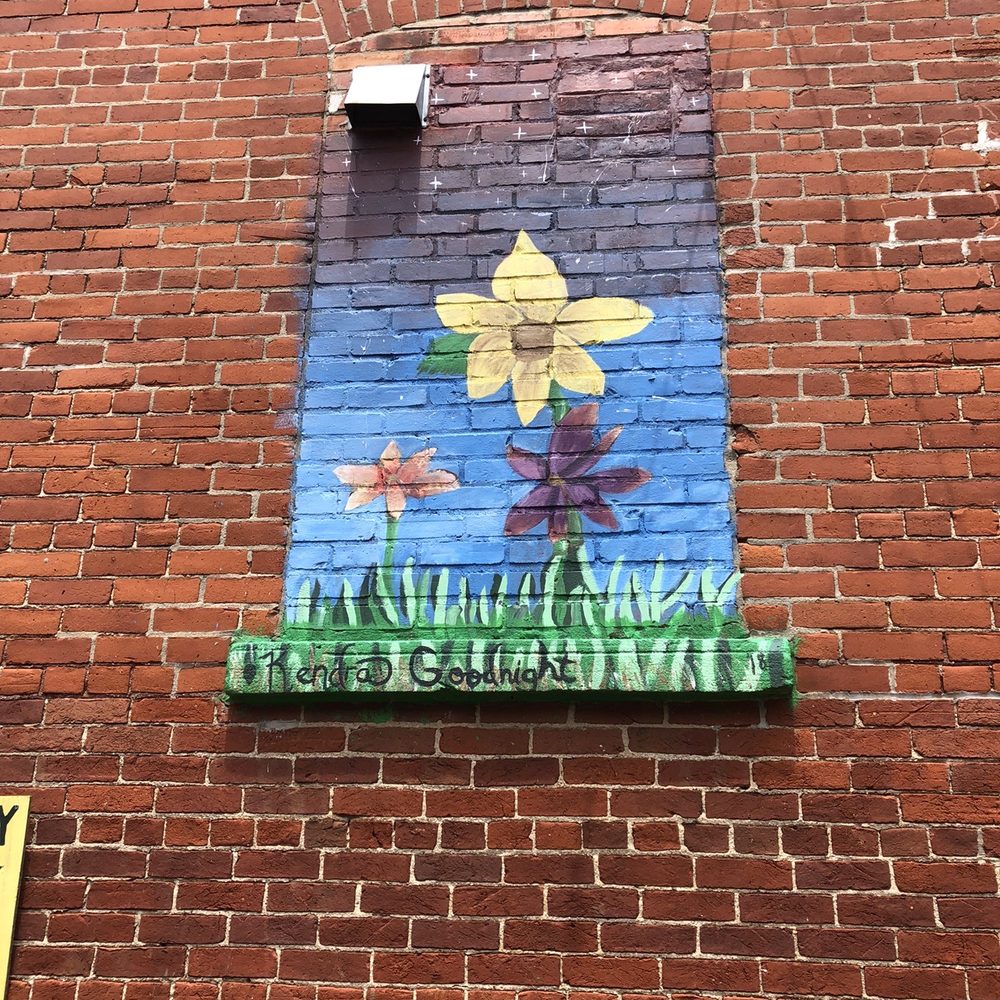 The Alley - a brick building with a painted window - American Near Me - Tipton, Indiana