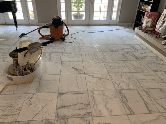 Marble & Stone Floor Polish Restoration - This white marble Floor was covered with spots and etching.  We diamond sanded this floor, polished to high shine and sealed it.  After we removed all old grout and add new grout.