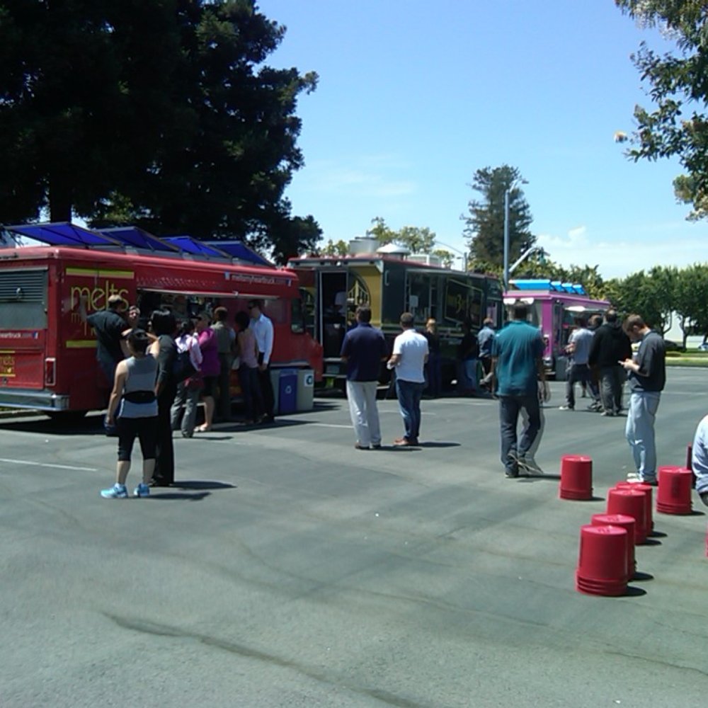 Moveable Feast - a line of food trucks in a parking lot - Food Trucks Near Me Moveable Feast - a line of food trucks in a parking lot - Food Trucks Near Me