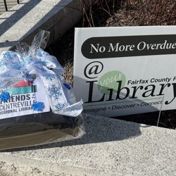 Centreville Regional Library - Gift for winter reading challenge and sign outside the library