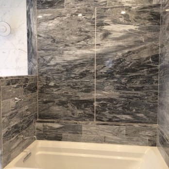The New Famar - Grey Calcutta slab bath tub surround - Interior Design Near Me - Medford, Massachusetts The New Famar - Grey Calcutta slab bath tub surround - Interior Design Near Me - Medford, Massachusetts