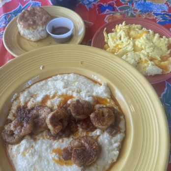 The Flying Biscuit Cafe - Creamy grits with Cajun Shrimp and Biscuit with a side of eggs with cheese. - Breakfast & Brunch Near Me - Mt. Pleasant, South Carolina The Flying Biscuit Cafe - Creamy grits with Cajun Shrimp and Biscuit with a side of eggs with cheese. - Breakfast & Brunch Near Me - Mt. Pleasant, South Carolina