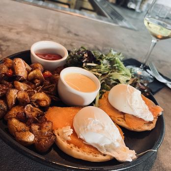 Lulu's Cafe & Cocktails - Eggs Benedict with smoked salmon roasted potatoes and greens. - Cocktail Bars Near Me - Delray Beach, Florida Lulu's Cafe & Cocktails - Eggs Benedict with smoked salmon roasted potatoes and greens. - Cocktail Bars Near Me - Delray Beach, Florida
