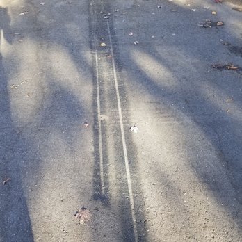 Mangual Remodeling and Renovation - Black spray paint on new asphalt where he decided to paint trim pieces. - General Contractors Near Me Mangual Remodeling and Renovation - Black spray paint on new asphalt where he decided to paint trim pieces. - General Contractors Near Me