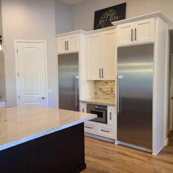 Champion Remodel - a kitchen with stainless steel appliances - General Contractors Near Me Champion Remodel - a kitchen with stainless steel appliances - General Contractors Near Me