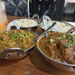 Mango lassi, channa masala, lamb curry, rice in the back Mango lassi, channa masala, lamb curry, rice in the back