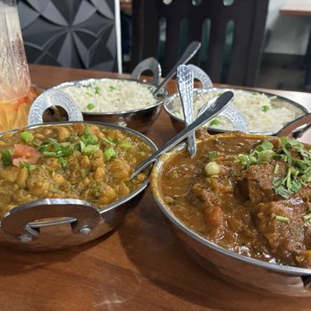 Maharaja Indian Cuisine - Mango lassi, channa masala, lamb curry, rice in the back - Indian Near Me - Lodi, California Maharaja Indian Cuisine - Mango lassi, channa masala, lamb curry, rice in the back - Indian Near Me - Lodi, California