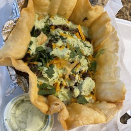 Taco bowl with beef, cilantro, lime sauce, cheddar cheese and white rice! Taco bowl with beef, cilantro, lime sauce, cheddar cheese and white rice!