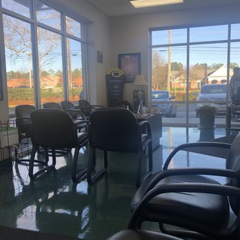 Atlantic Tire & Service - Waiting room. Lots of windows! Has a tv and several outlets should you need to charge your phone. Complimentary WiFi too. - Auto Repair Near Me - Durham, North Carolina