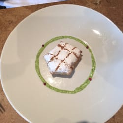 Restaurant Le Tire-Bouchon Cafe-Bistro - Bastilla - Moroccan filo dough with beef, cinnamon, nuts, powdered sugar and orange pesto base sauce