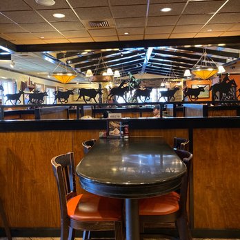 LongHorn Steakhouse - a table and chairs - Steakhouses Near Me - Piscataway, New Jersey