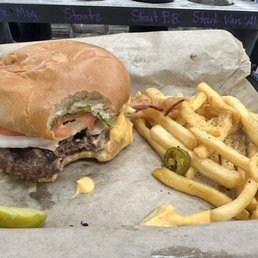 Burger with beer cheese, jalapeños, and grilled onions