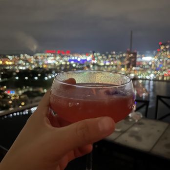 The Bygone - Bygone Daisy cocktail with city view - American Near Me - Baltimore, Maryland The Bygone - Bygone Daisy cocktail with city view - American Near Me - Baltimore, Maryland