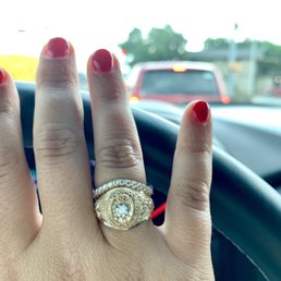 Added diamond center stone and custom band to surround Added diamond center stone and custom band to surround