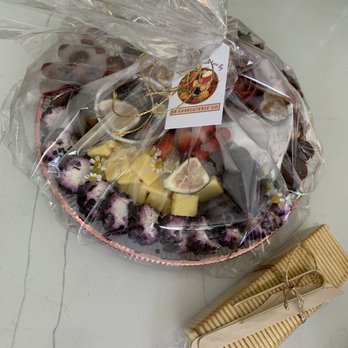 SB Charcuterie Co - a plate of fruit and a comb - Food Delivery Services Near Me SB Charcuterie Co - a plate of fruit and a comb - Food Delivery Services Near Me