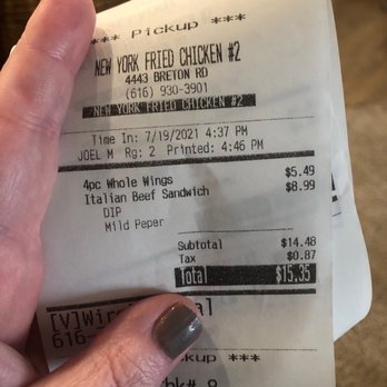 New York Fried Chicken - a hand holding a receipt - Chicken Wings Near Me - Grand Rapids, Michigan New York Fried Chicken - a hand holding a receipt - Chicken Wings Near Me - Grand Rapids, Michigan