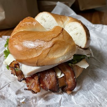 Maya Bagel Express - Turkey Club Sandwich on plain bagel. Bacon made this good sandwich even better. - Bagels Near Me - Louisville, Kentucky Maya Bagel Express - Turkey Club Sandwich on plain bagel. Bacon made this good sandwich even better. - Bagels Near Me - Louisville, Kentucky