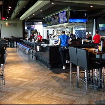 Topgolf - View of the large bar from the dining room. - Golf Near Me - Roseville, California Topgolf - View of the large bar from the dining room. - Golf Near Me - Roseville, California