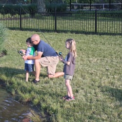 Fishing at the pond during a family camp out the City of UA Sponsors