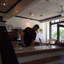 Shop proprietor at the bar.