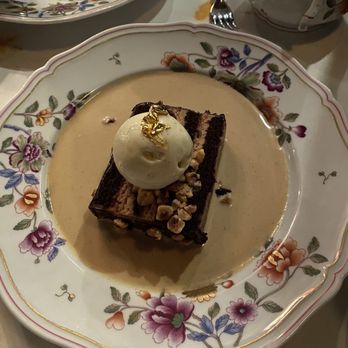 Carbone - Chocolate hazelnut cake w/vanilla ice cream & coffee liquid - Italian Near Me - New York, New York Carbone - Chocolate hazelnut cake w/vanilla ice cream & coffee liquid - Italian Near Me - New York, New York
