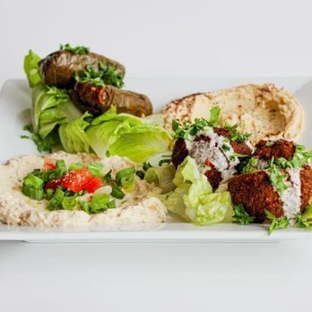 Montaha's - a plate of food with pita, lettuce, and hummus - Bistros Near Me - Swift Current, Saskatchewan Montaha's - a plate of food with pita, lettuce, and hummus - Bistros Near Me - Swift Current, Saskatchewan