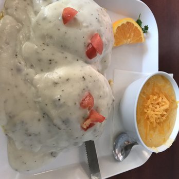 Biscuits & Gravy - Country Benedict $9 biscuit, egg, sausage, gravy, tomato & great cheesy grits. - Breakfast & Brunch Near Me - Canton, Michigan