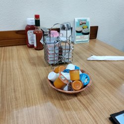 Clean table, clean condiments, jelly and creamer already waiting.