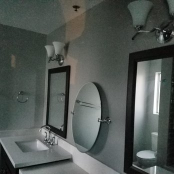 Ferguson Home - Vanity lights, oval mirror, faucets, towel rack and rings from Ferguson - Kitchen & Bath Near Me - Pasadena, California Ferguson Home - Vanity lights, oval mirror, faucets, towel rack and rings from Ferguson - Kitchen & Bath Near Me - Pasadena, California
