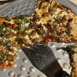 Old Chicago Pizza + Taproom - Build your own pizza, thin crust, Italian sausage, fresh basil, caramelized onions, sun dried tomatoes, and toasted garlic.