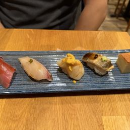 Left to right (omakase part 1) Chutoro, Japanese striped jack, Hokkaido scallop with uni, anago, egg castella Left to right (omakase part 1) Chutoro, Japanese striped jack, Hokkaido scallop with uni, anago, egg castella