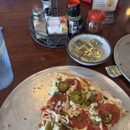 Margarita pizza with pepperoni & jalapeños added Margarita pizza with pepperoni & jalapeños added