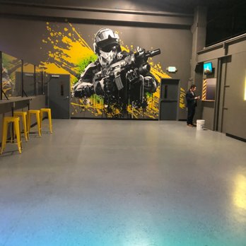 LazerX Arena - LazerX poster man shoots - Laser Tag Near Me - Kirkland, Washington