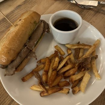 Stone & Oak - December 2023 - Prime Rib Sandwich with provolone, caramelized onions, and horseradish served with fries - Cocktail Bars Near Me - White Bear Lake, Minnesota Stone & Oak - December 2023 - Prime Rib Sandwich with provolone, caramelized onions, and horseradish served with fries - Cocktail Bars Near Me - White Bear Lake, Minnesota