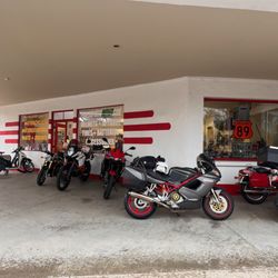 Encore Performance & Fabrication - My bike with new tire kept in good company by the shop's used selection.