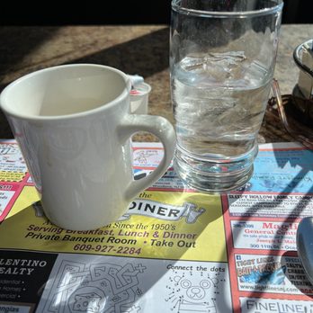 Somers Point Diner - a cup of water and a cell phone - American Near Me - Somers Point, New Jersey