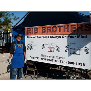 Rib Brothers - a man standing in front of a sign - Barbeque Near Me - Alsip, Illinois Rib Brothers - a man standing in front of a sign - Barbeque Near Me - Alsip, Illinois